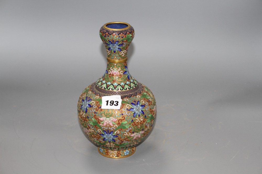 A Chinese champleve enamelled gilt brass vase, decorated with flowers, height 23cm